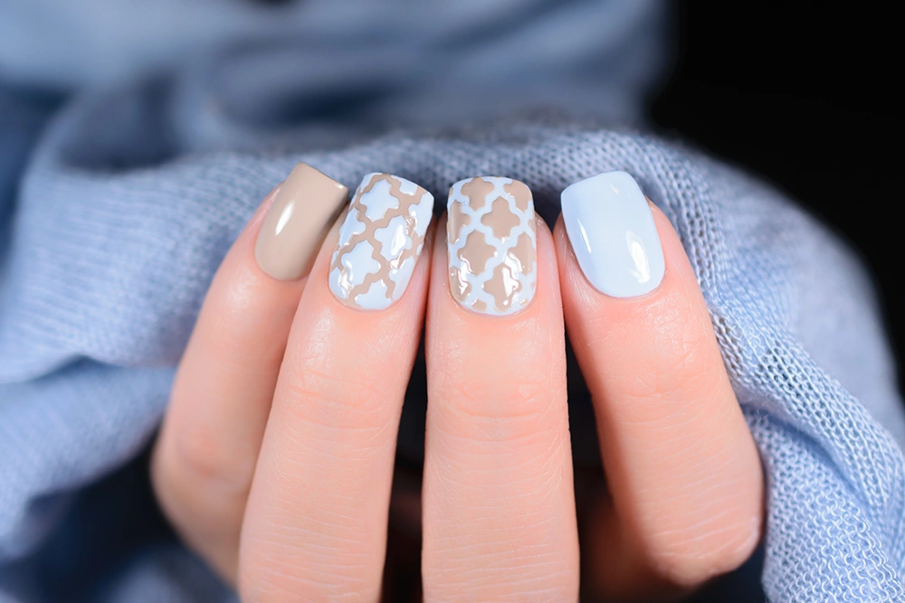 Pastel manicure in beige and white